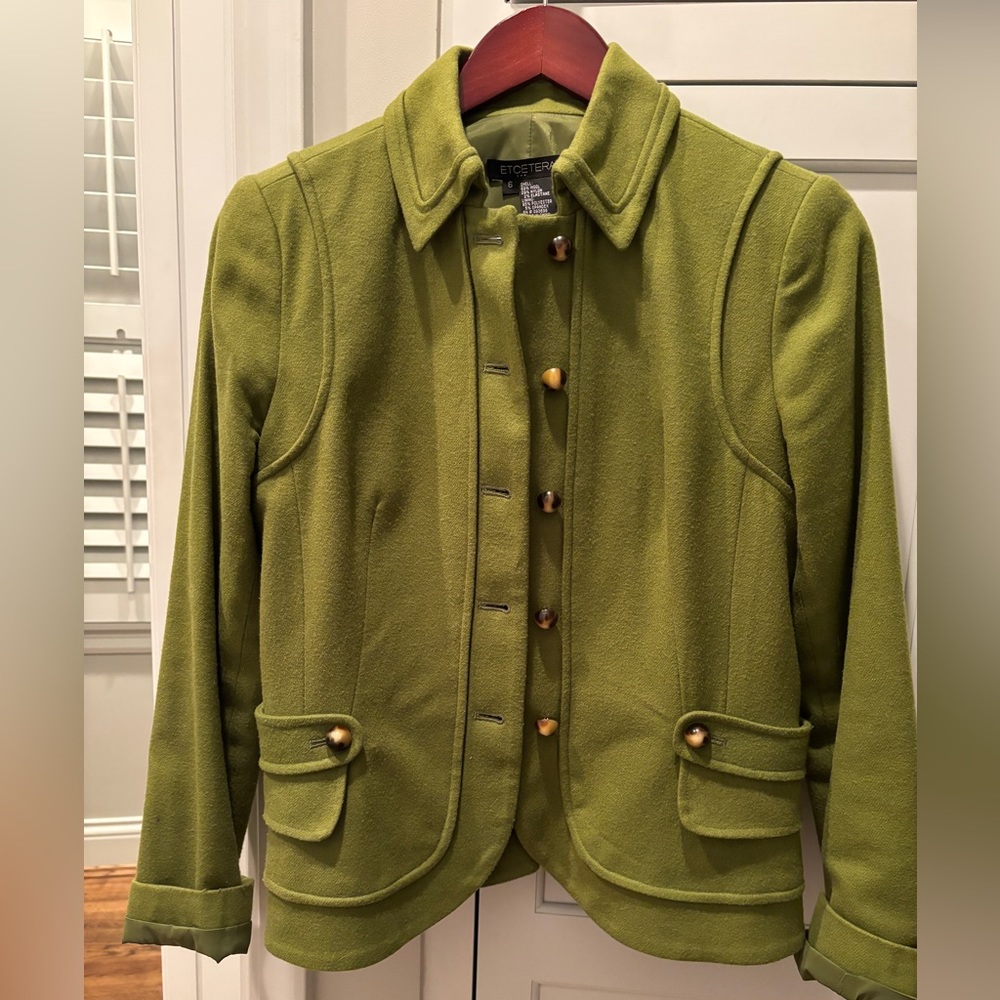 Boutique wool jacket w horn button details.
